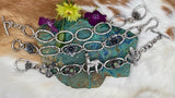 Hammered ovals with Succulent blooms. Hand cast sterling silver bracelet