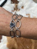 Hammered ovals with Succulent blooms. Hand cast sterling silver bracelet