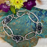 Hammered ovals with Succulent blooms. Hand cast sterling silver bracelet